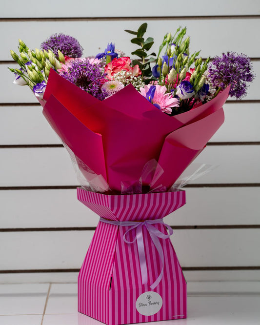 Pink flowers blooming in a garden on a sunny day